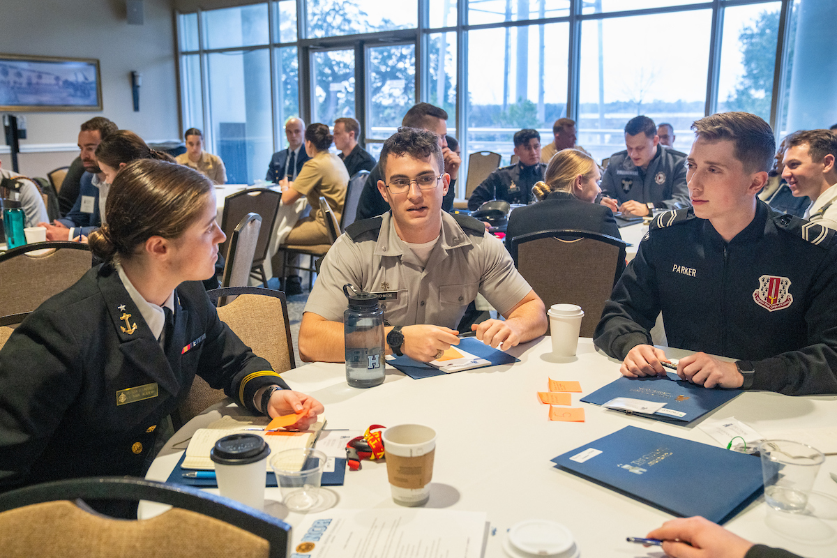 Students from some of the 11 military colleges chat during the first Citadel Honor Conference on Thursday February 9, 2023 in Charleston, South Carolina.  In addition to the Citadel, the Air Force Academy, The Coast Guard Academy, The Merchant Marine Academy, Norwich University, The Naval Academy, Texas A&M, University of North Georgia, Virginia Military Institute, Virgina Tech, and West Point participated in the first ever conference of its kind.(Ed Wray/The Citadel)